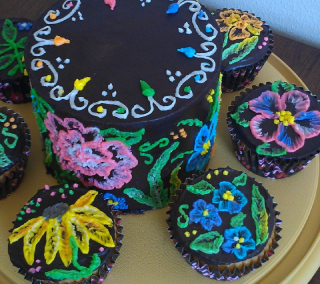 Chocolate ganache covered cake and cupcakes with hand-brushed homemade buttercream icing flowers in bright colors